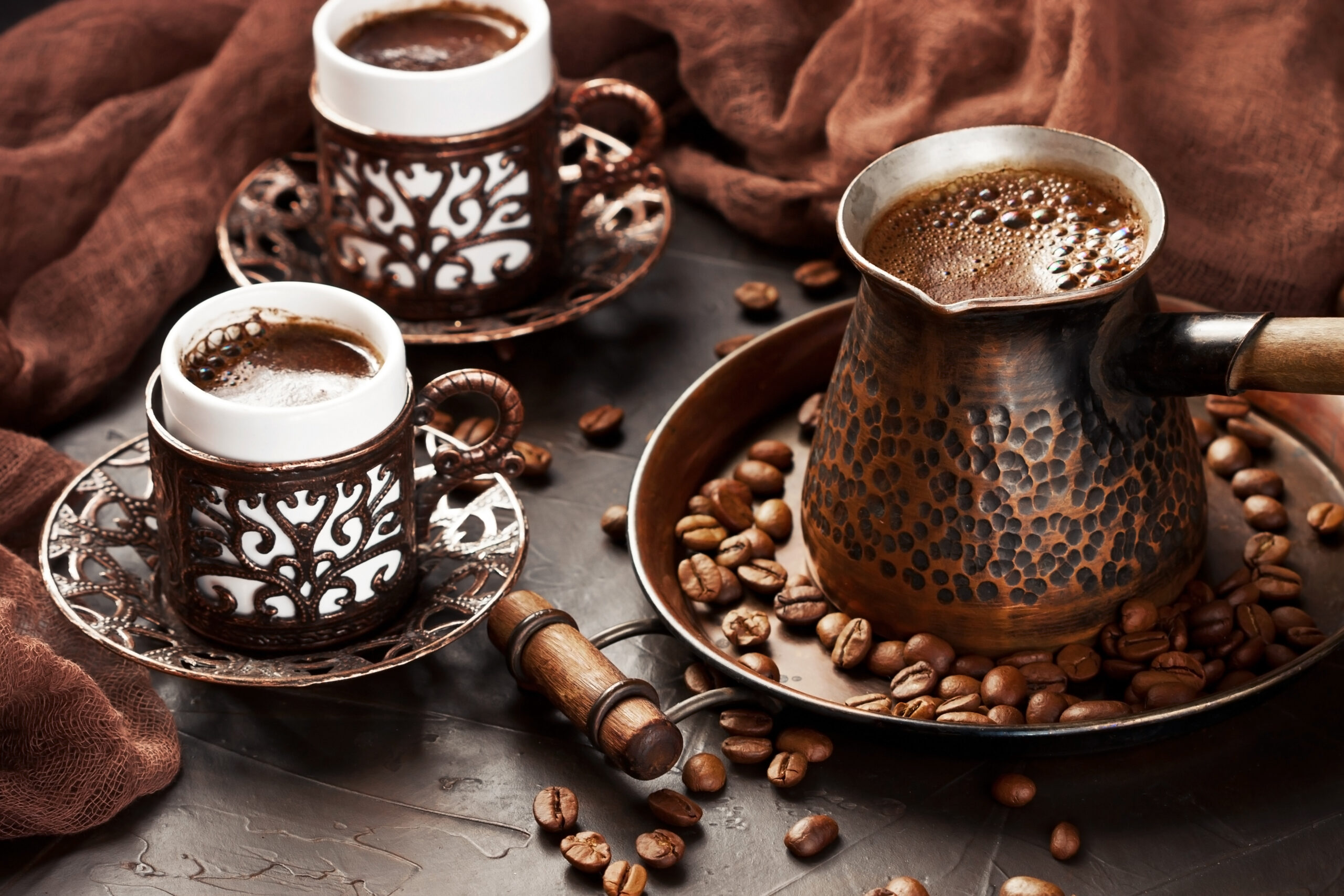 Freshly,Made,Coffee,In,Old,Turkish,Cezve,On,Dark,Background